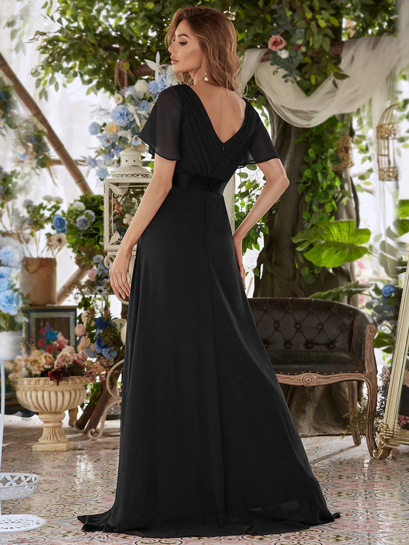 Black bridesmaid dress or formal dress in chiffon with satin band and short sleeves.