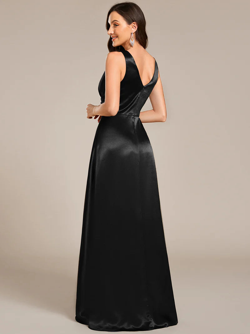 Black satin bridesmaid dress with v-neck and pockets.