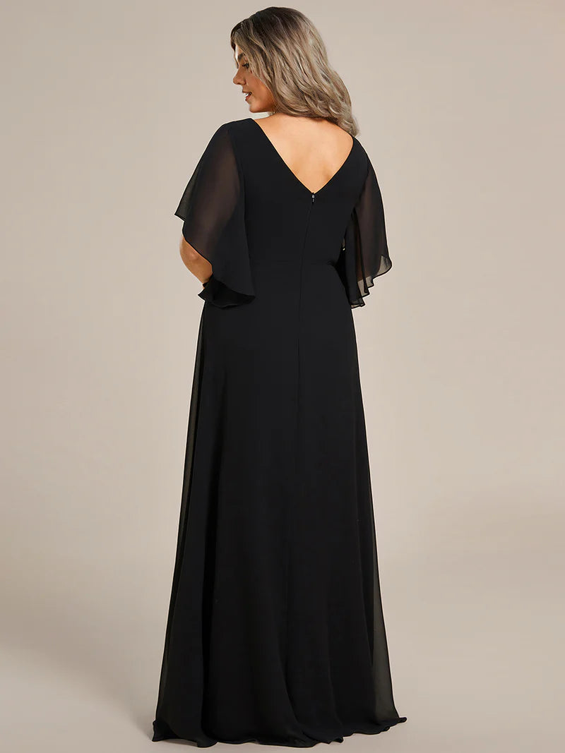 Black embroidered mother of the bride or bridesmaid chiffon sleeve dress.