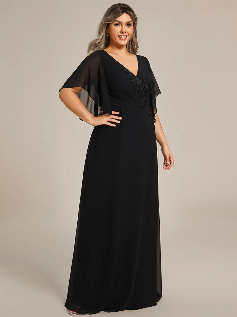 Black embroidered mother of the bride or bridesmaid chiffon sleeve dress.