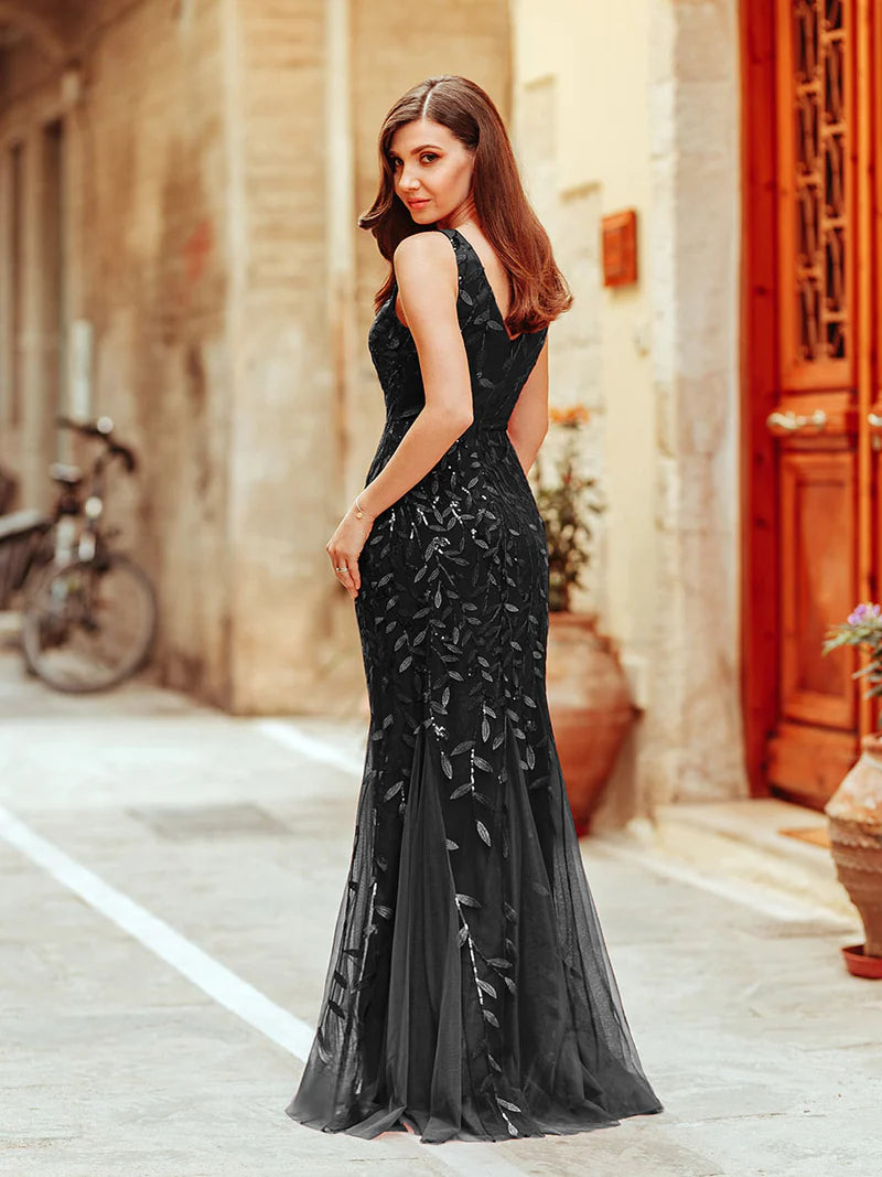 Black formal dress with fishtail and sequins.