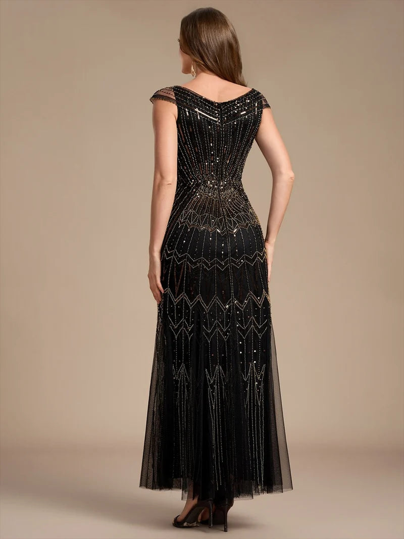 Black and Gold mother of the bride dress with sequin embellishment and short cap sleeve.