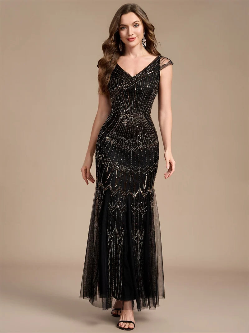 Black and Gold mother of the bride dress with sequin embellishment and short cap sleeve.