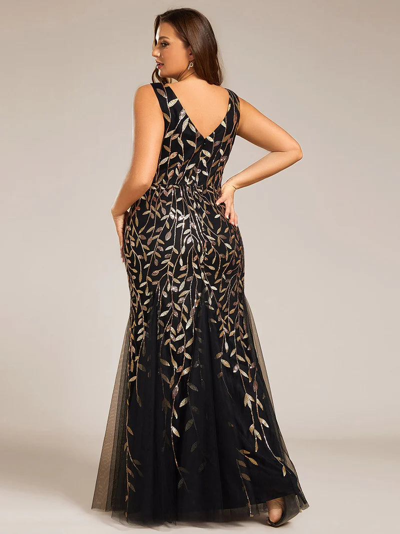 Black and gold plus sized dress with fishtail and sequin.