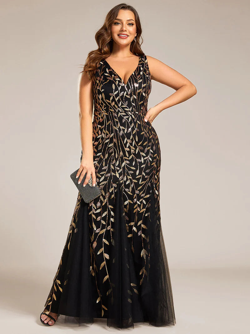 Black and gold plus sized dress with fishtail and sequin.