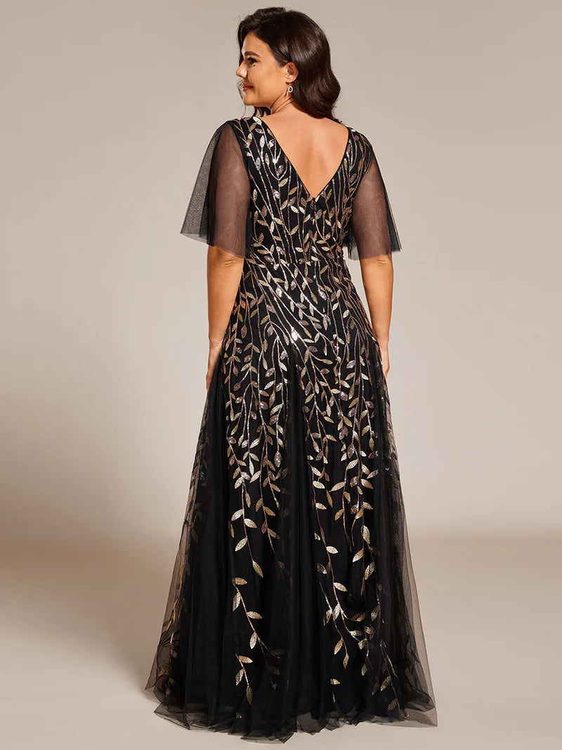 Black and Gold plus size mother of the bride dress with short sleeves and flowing tulle.