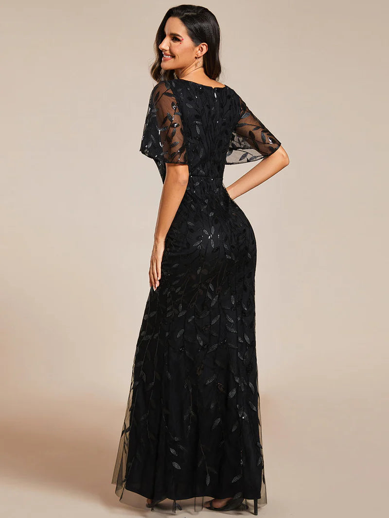 Black mother of the bride or formal dress with tulle, sequins and lace ruffle sleeves.