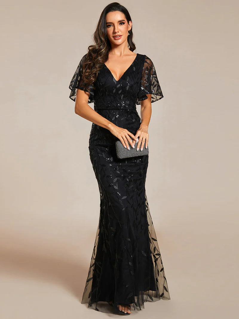 Black mother of the bride or formal dress with tulle, sequins and lace ruffle sleeves.