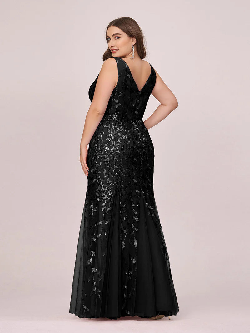 Black plus sized dress with fishtail and sequin.