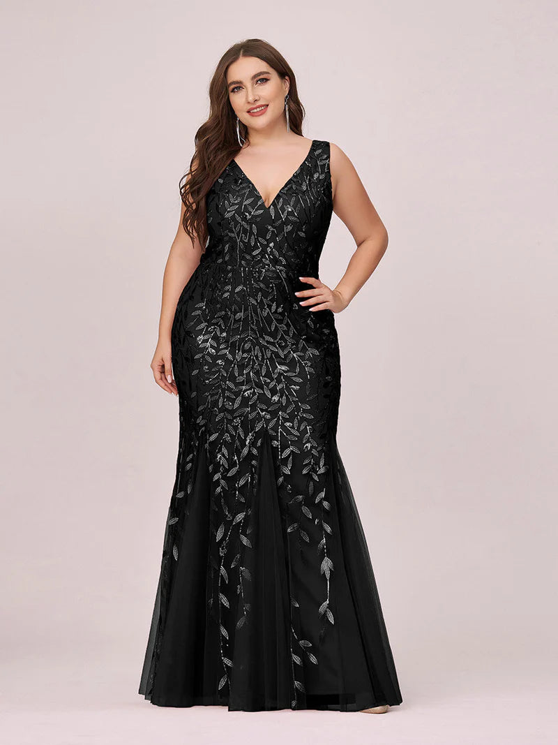 Black plus sized dress with fishtail and sequin.