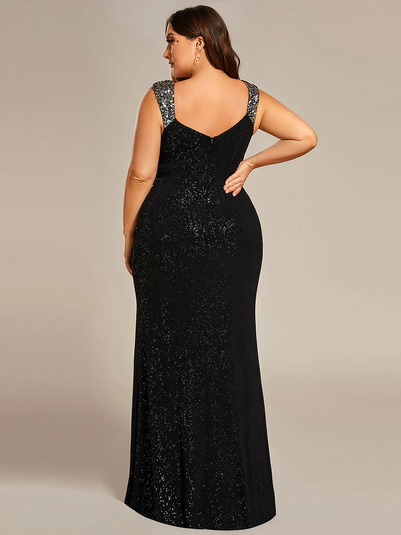 Black plus sized formal dress with glitter and split front.