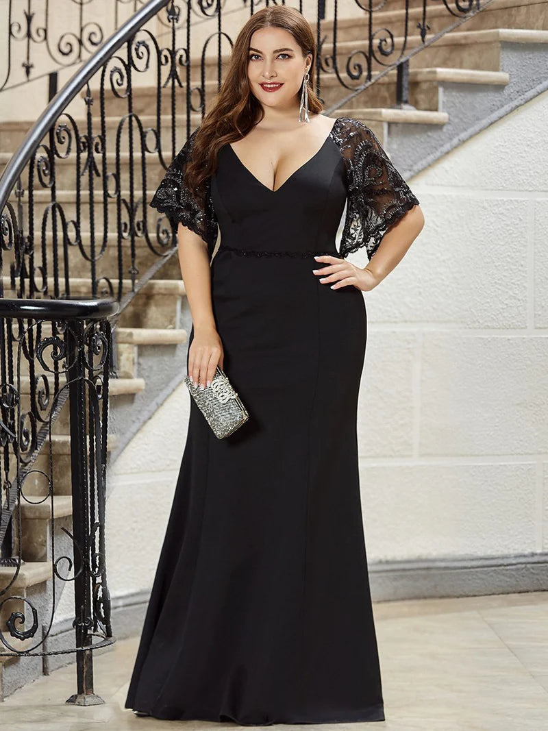 Black Plus size formal, mother of the bride, evening dress with lace sleeves, v-neck and fishtail.