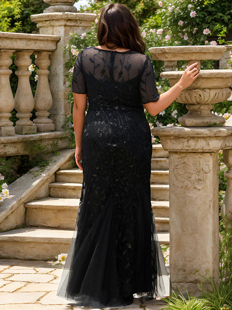 Black Plus Size Mother of the bride or formal dress, short sleeve with tulle, lace and sequin detailing.