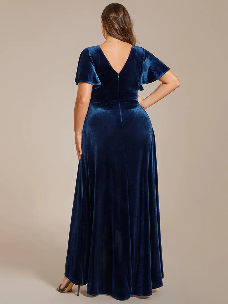 Blue velvet plus size formal dress with asymetric hem.