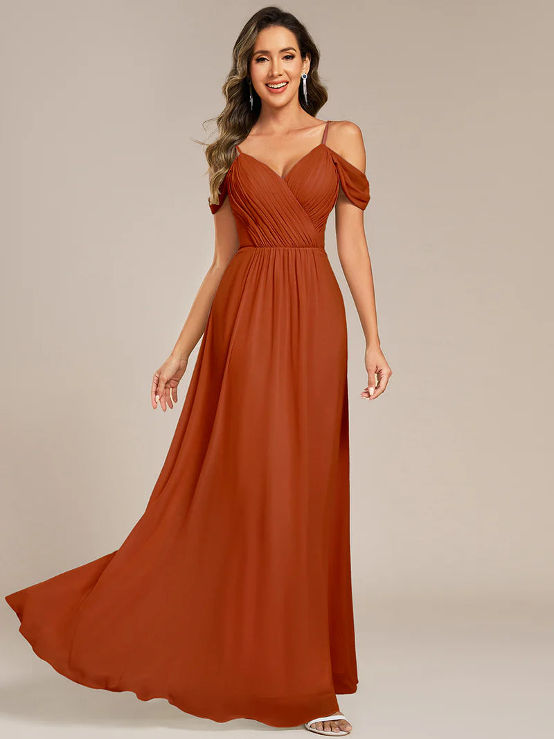 Burnt orange bridesmaid dress with a A-line and spaghetti straps.