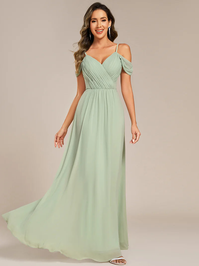 Mint green bridesmaid dress with a A-line and spaghetti straps.