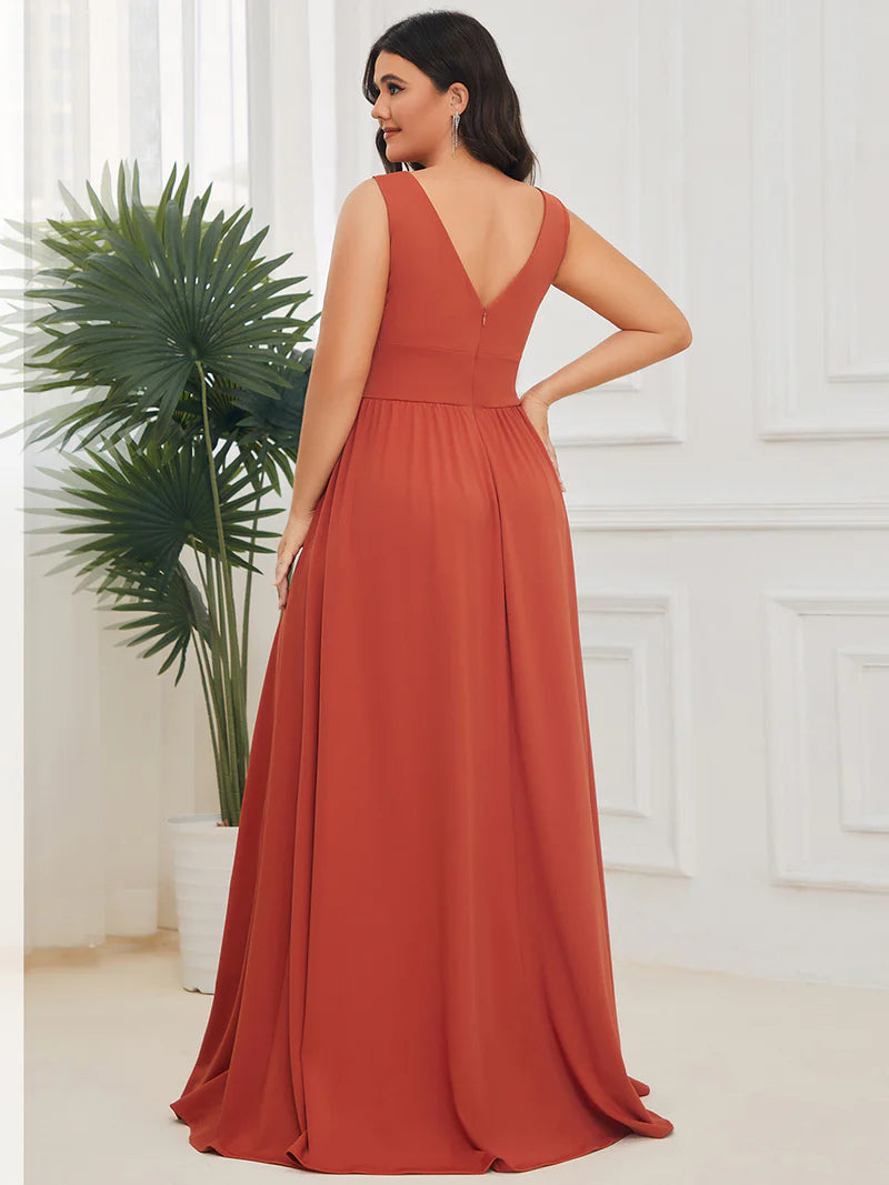 Plus sized burnt orange bridesmaid dress with sleeveless and deep v-neck.