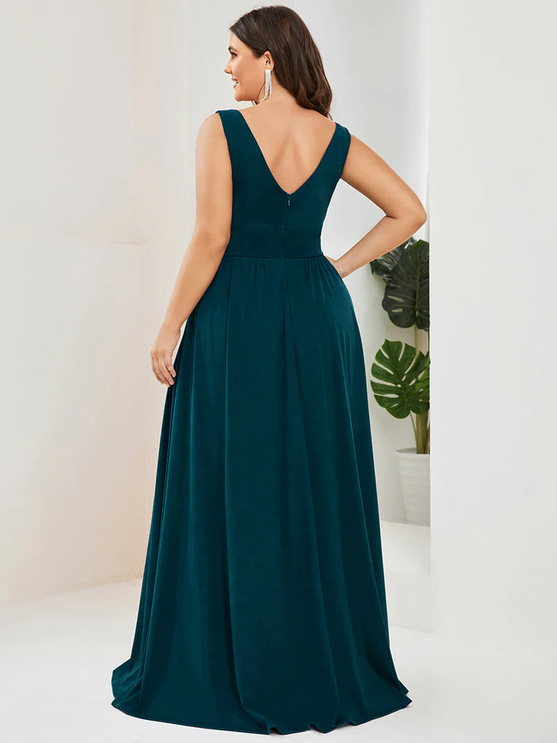 Plus sized teal bridesmaid dress with sleeveless and deep v-neck.