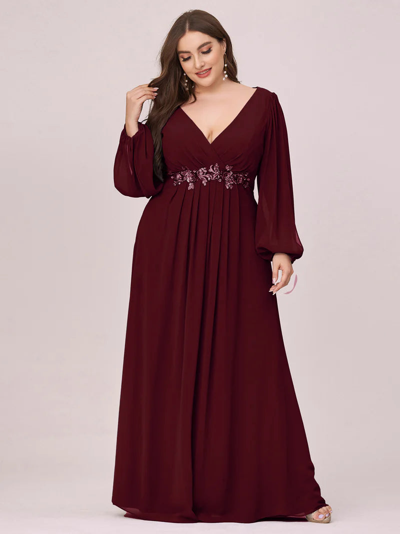 Burgundy long sleeve plus size formal dress with applique detail.