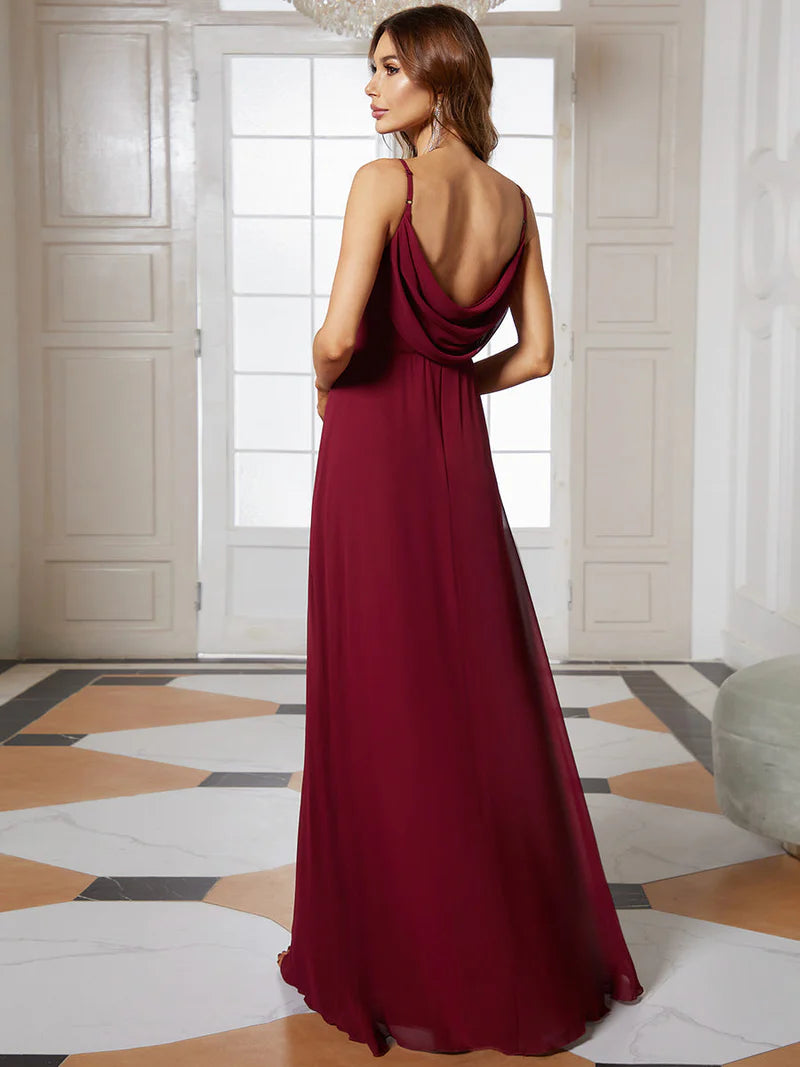 Sleeveless burgundy red bridesmaid dress with spaghetti straps.