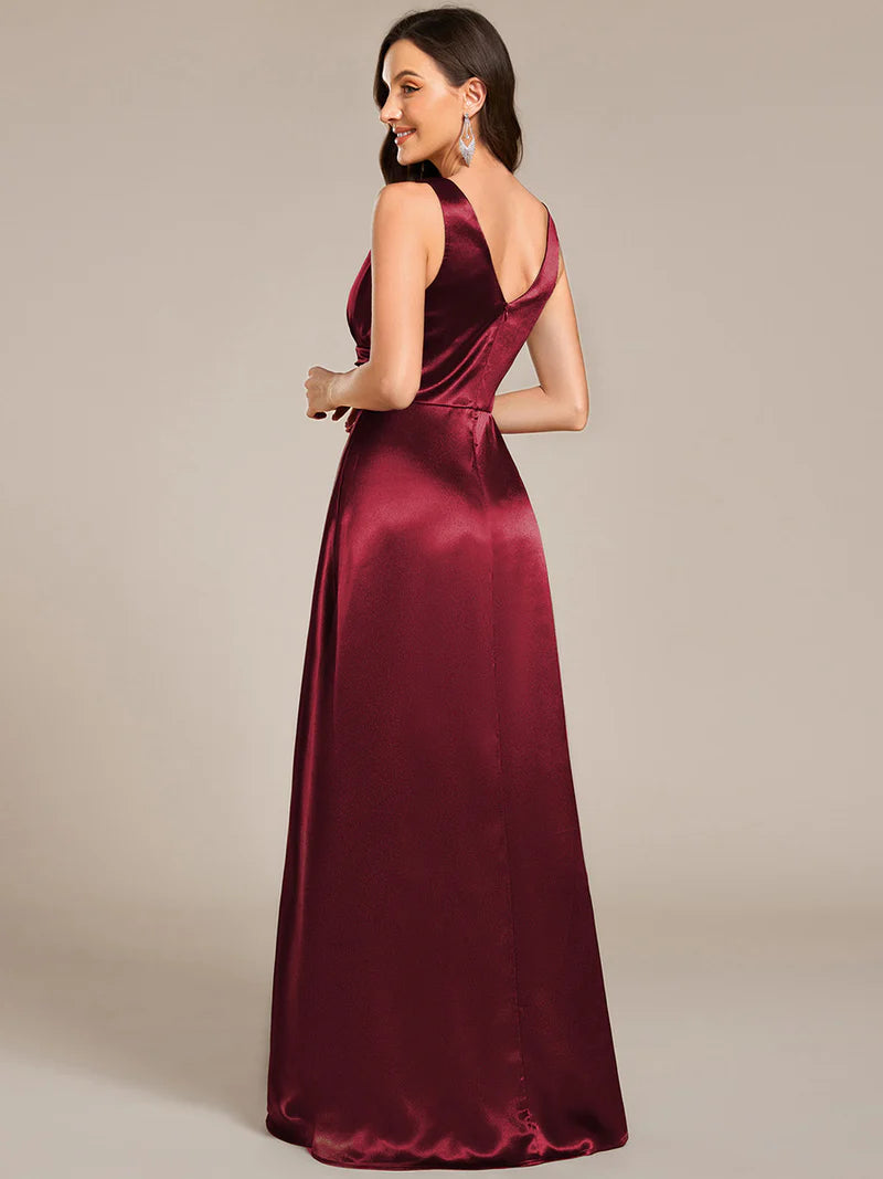 Burgundy red satin bridesmaid dress with v-neck and pockets.