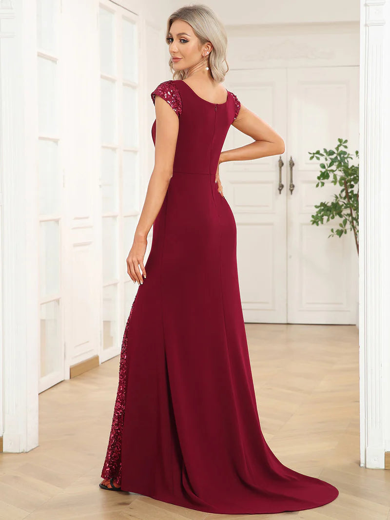 Burgundy red formal or evening dress with cap sleeves, lace and sequin insert with mermaid tail.