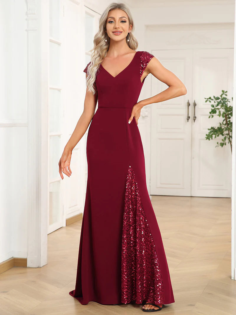 Burgundy red formal or evening dress with cap sleeves, lace and sequin insert with mermaid tail.