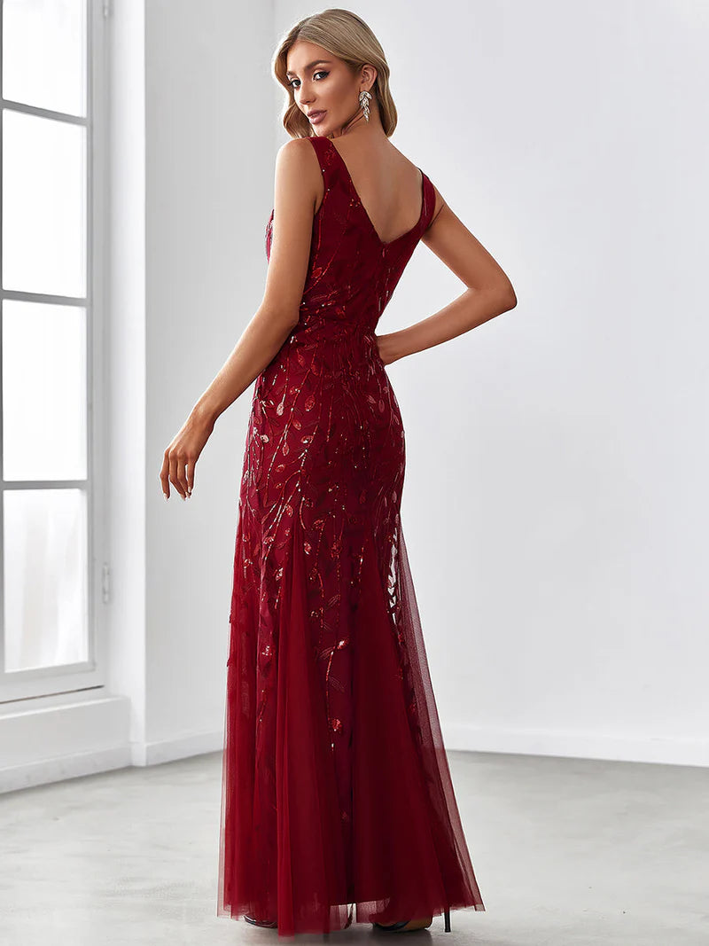 Burgundy red formal dress with fishtail and sequins.