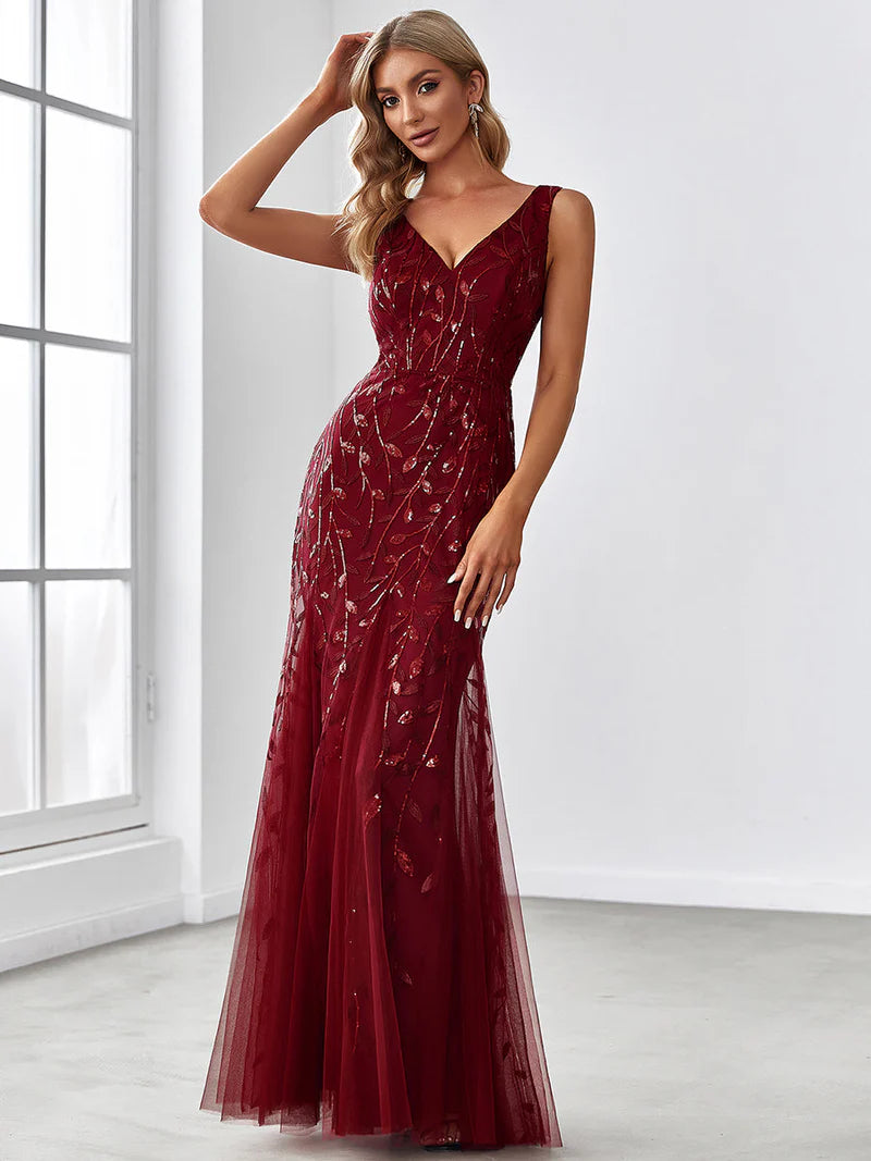 Burgundy red formal dress with fishtail and sequins.