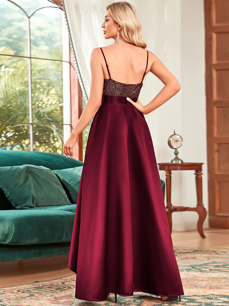 Burgundy red hi low sleeveless satin formal or mother of the bride dress with bodice detailing.