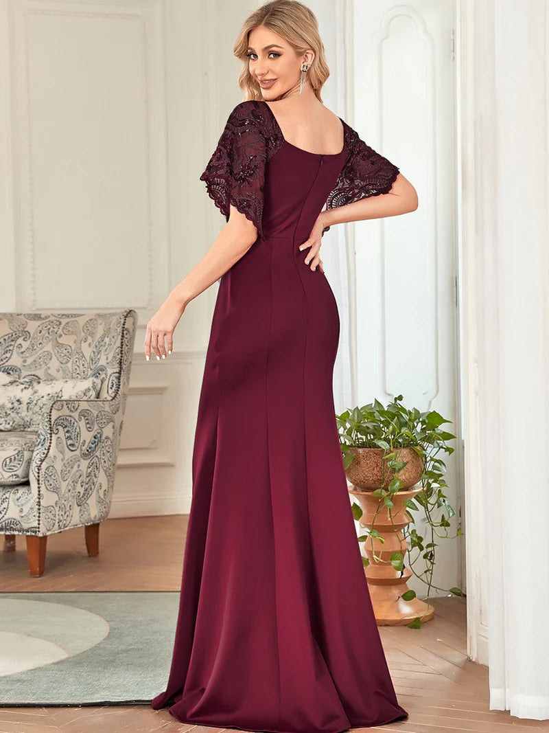 Burgundy red formal or mother of the bride dress with lace sleeves, v-neck and fishtail.