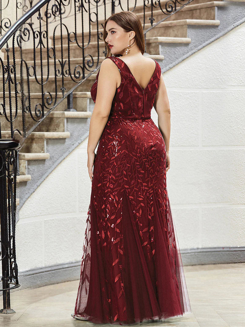 Burgundy red plus sized dress with fishtail and sequin.