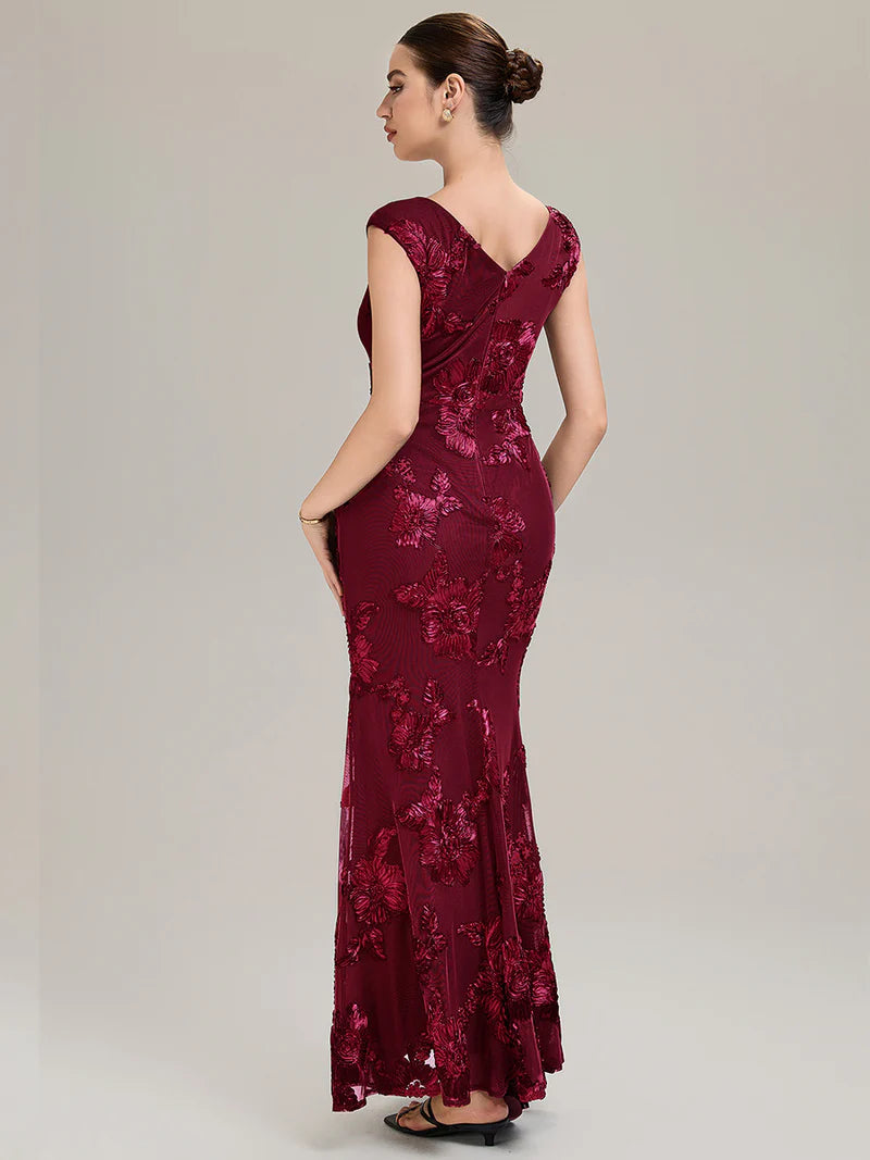 Burgundy mother of the bride dress with ribbon detail and sheath mermaid style.