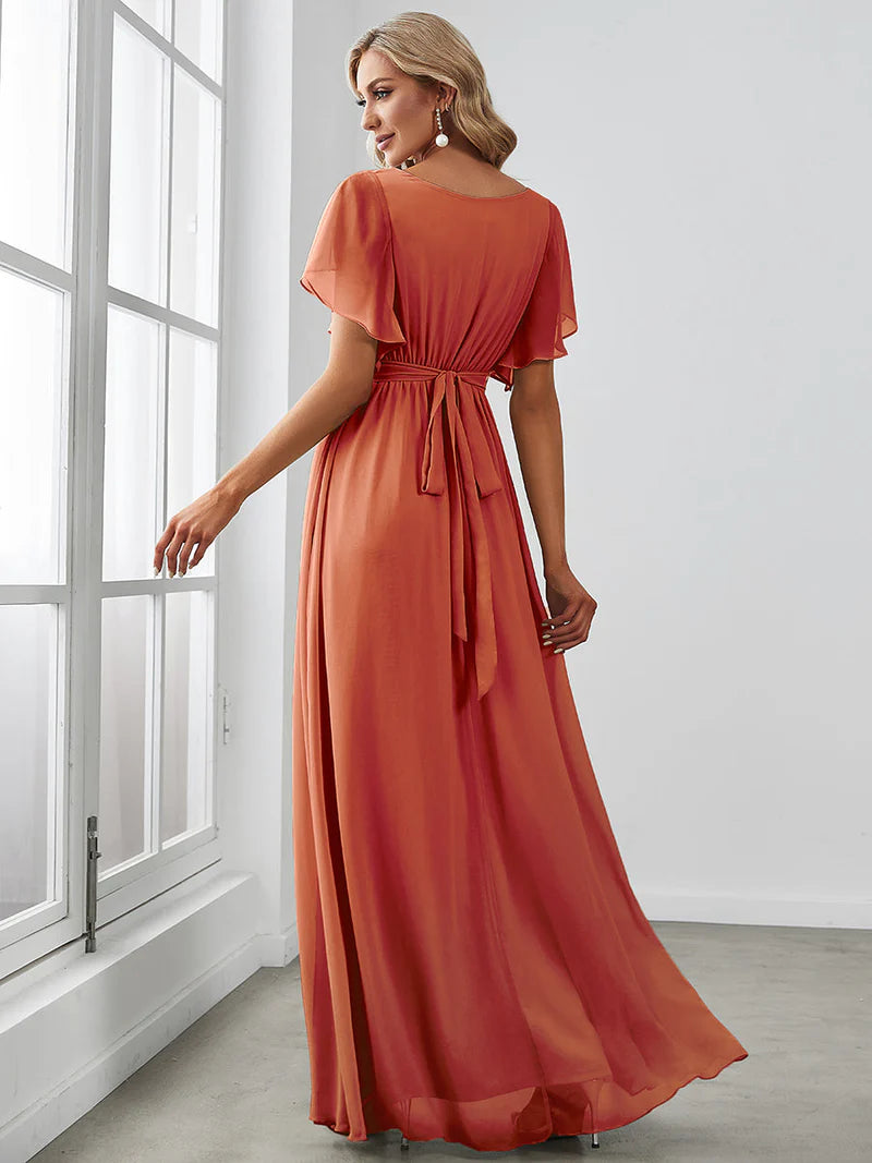 Burnt orange bridesmaid dress with v-neck and a-line.