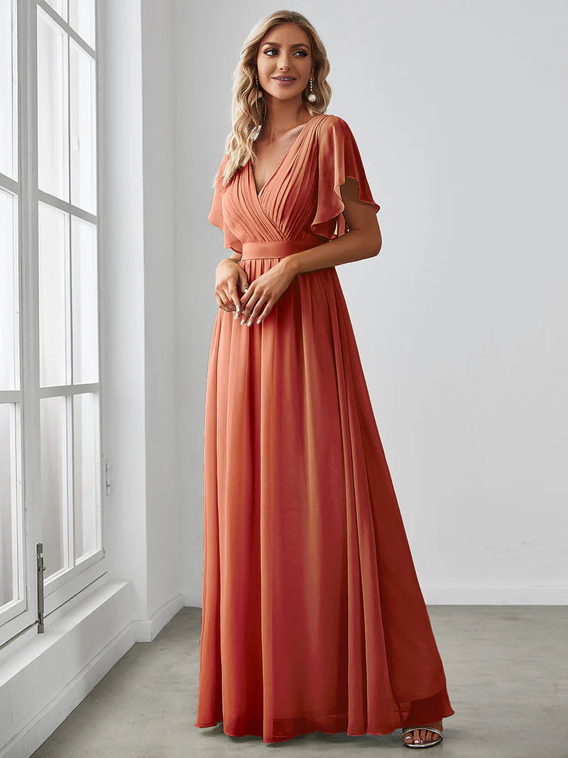 Burnt orange bridesmaid dress with v-neck and a-line.