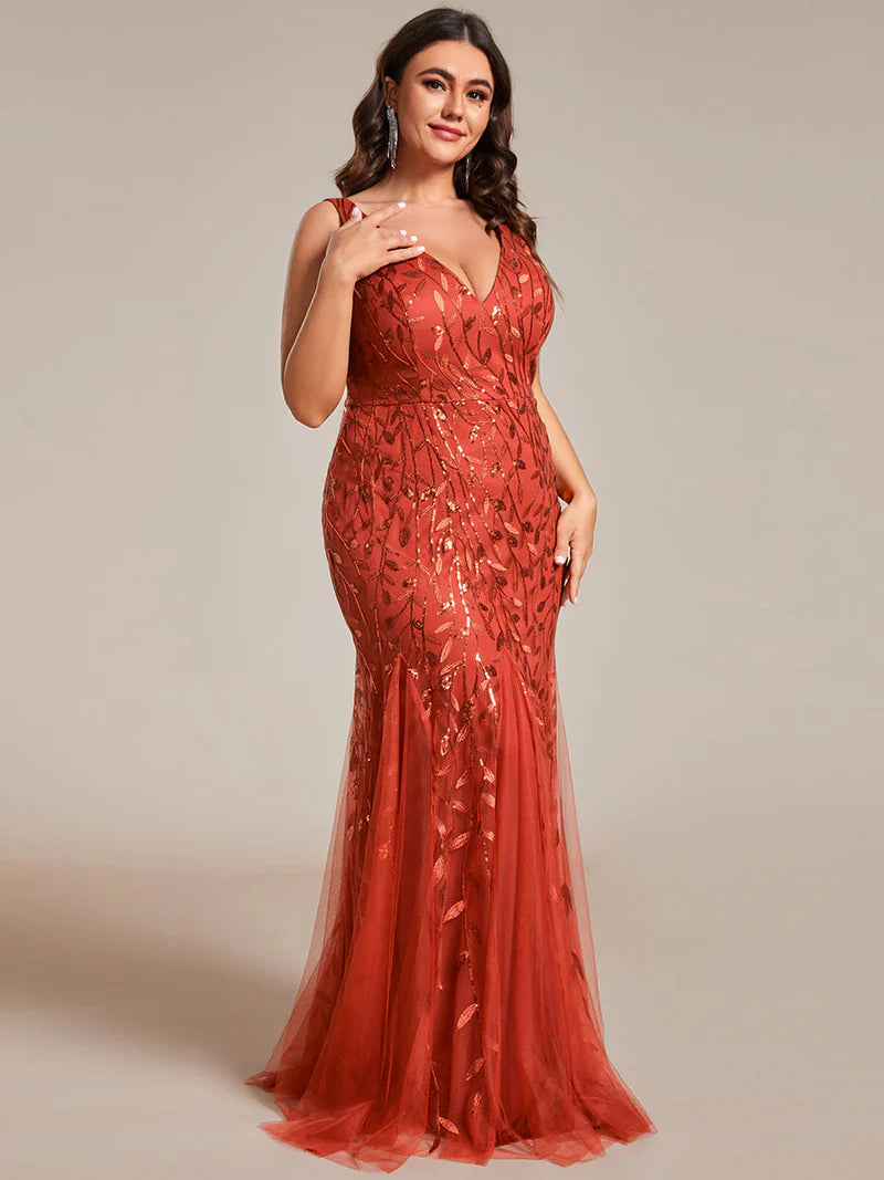 Burnt orange formal dress with fishtail and sequins.