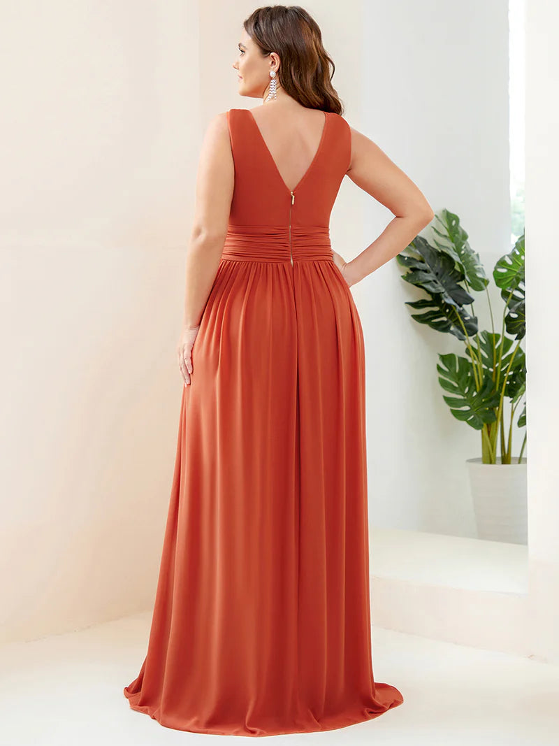 Burnt orange plus sized bridesmaid dress with double v-neck and chiffon.