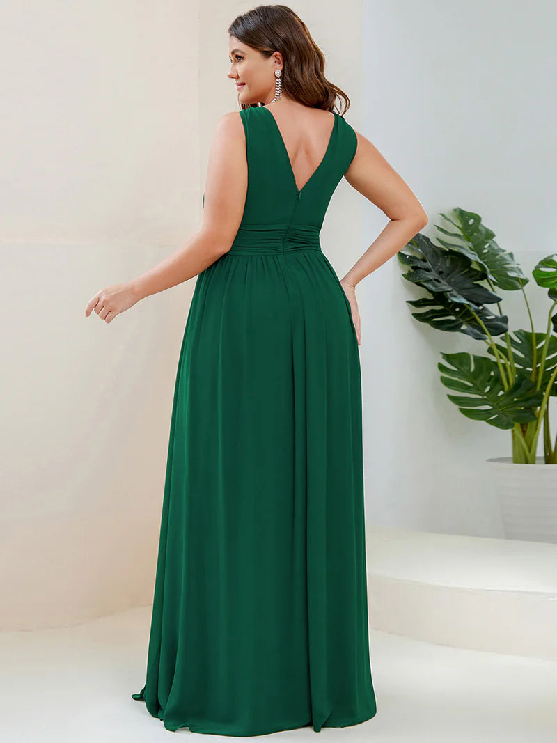 Dark green plus sized bridesmaid dress with double v-neck and chiffon.
