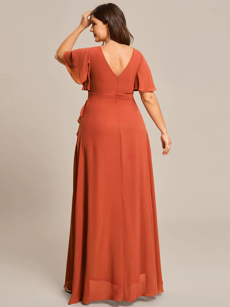 Burnt orange plus sized bridesmaid dress with high low ruffle and chiffon.