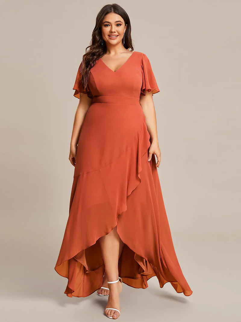 Burnt orange plus sized bridesmaid dress with high low ruffle and chiffon.