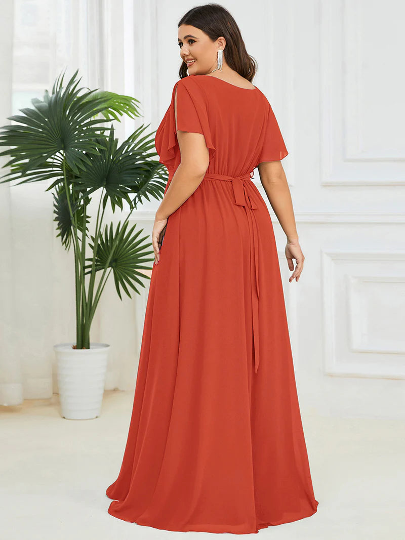Burnt orange plus sized bridesmaid dress with v-neck and a-line.