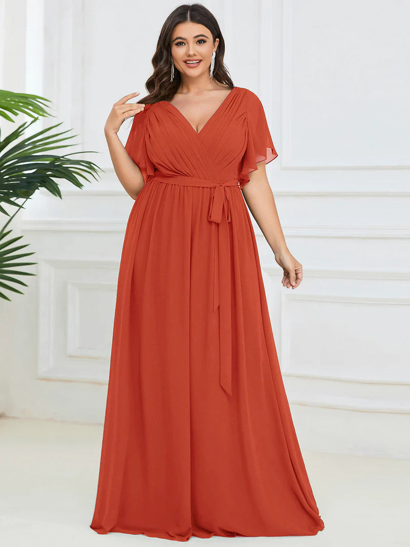 Burnt orange plus sized bridesmaid dress with v-neck and a-line.