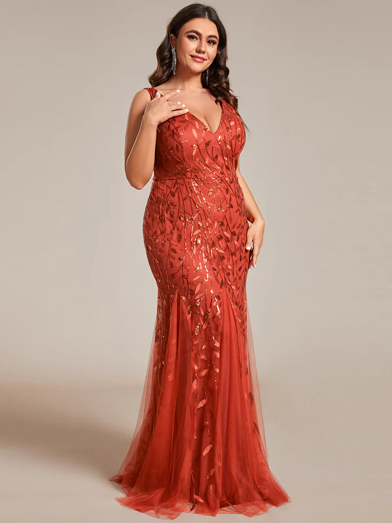 Burnt orange plus sized dress with fishtail and sequin.