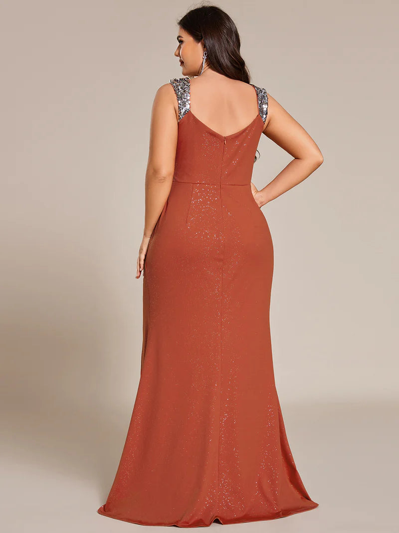 Burnt orange plus sized formal dress with glitter and split front.