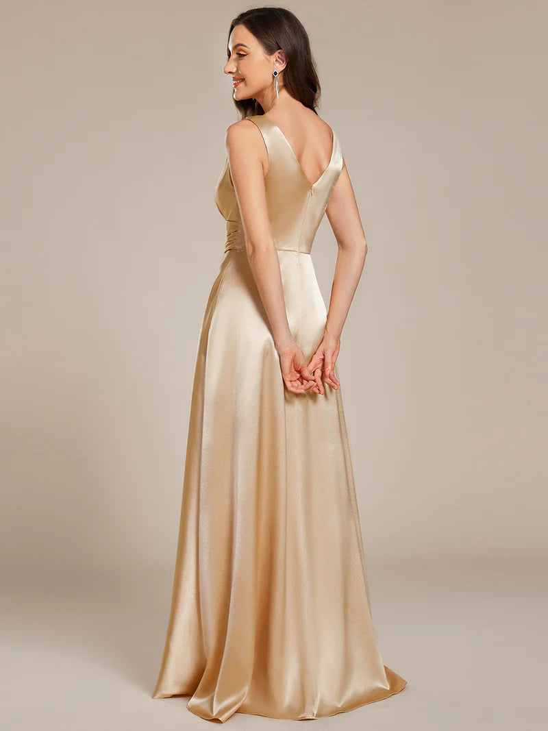 Champagne satin bridesmaid dress with v-neck and pockets.