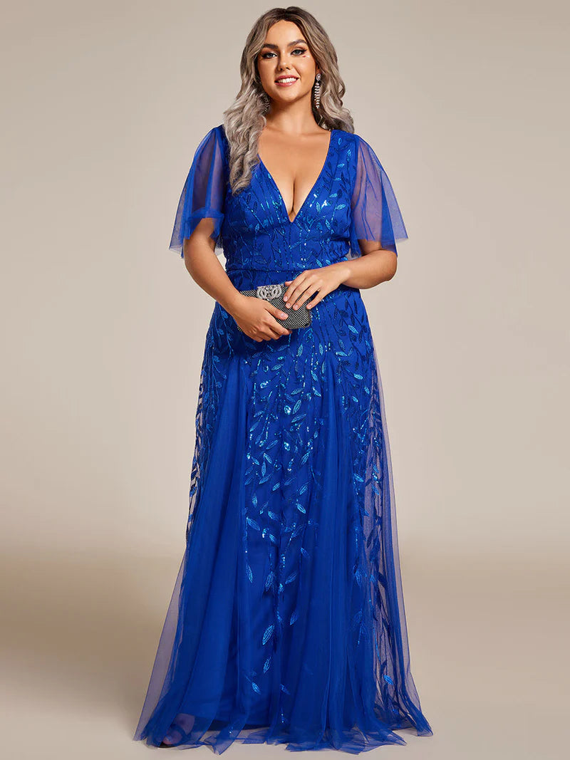 Cobalt blue plus size mother of the bride dress with short sleeves and flowing tulle.