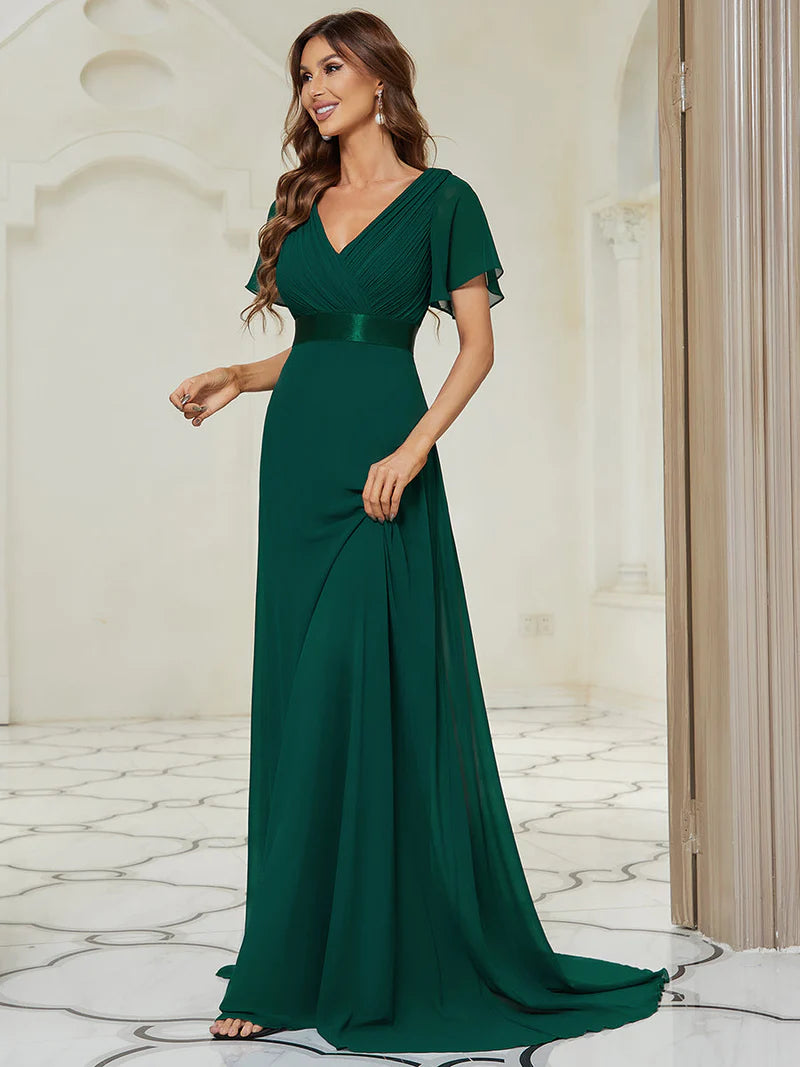 Dark green bridesmaid dress or formal dress in chiffon with satin band and short sleeves.