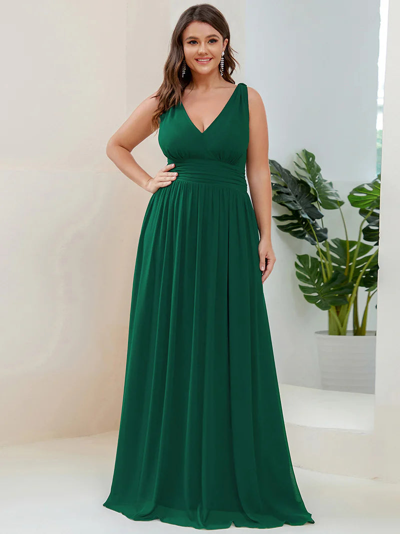 Dark green plus sized bridesmaid dress with double v-neck and chiffon.