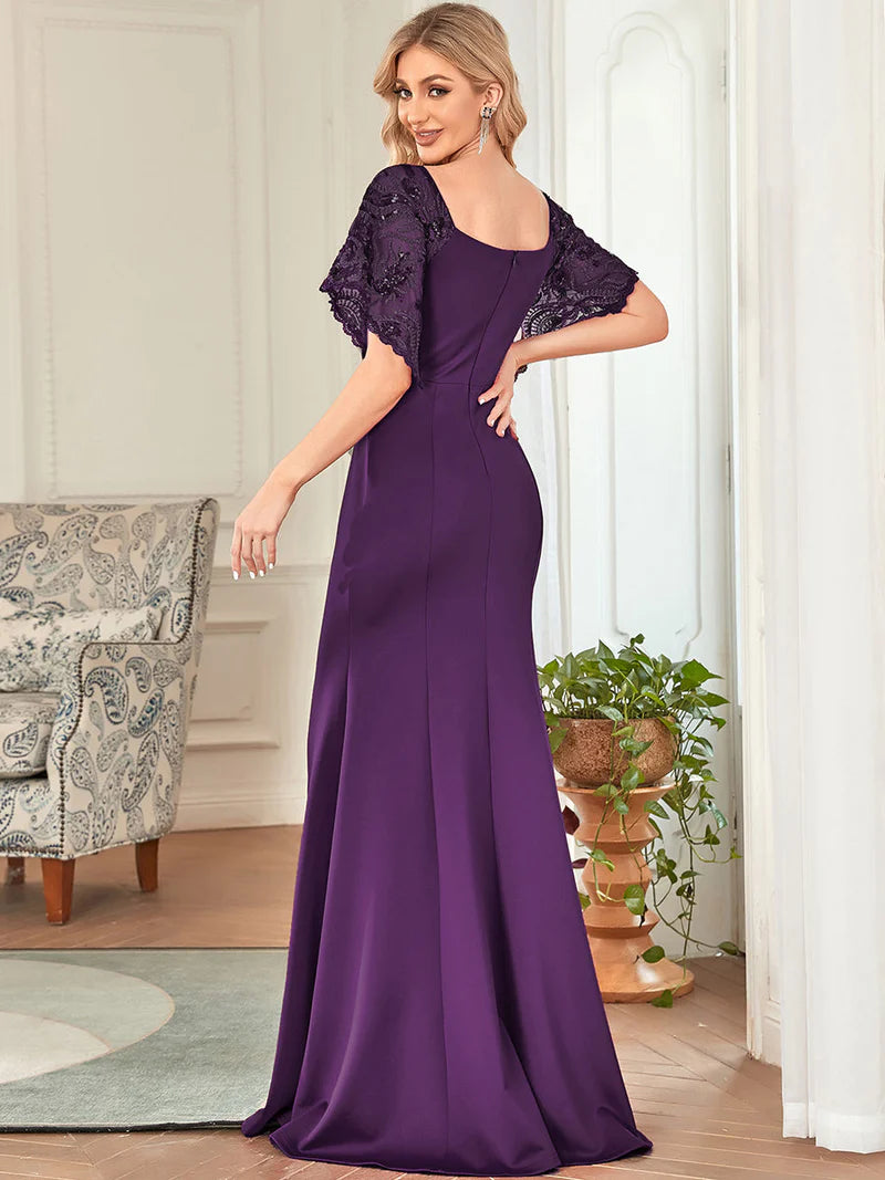 Deep purple mother of the bride dress with lace sleeves, v-neck and fishtail.