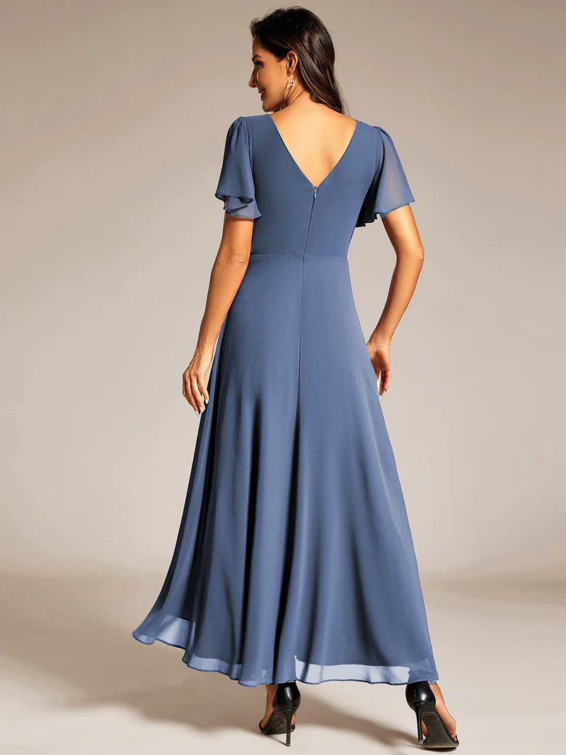 Dusty Blue A-line mother of the bride dress with a sequin band detail and short sleeves.
